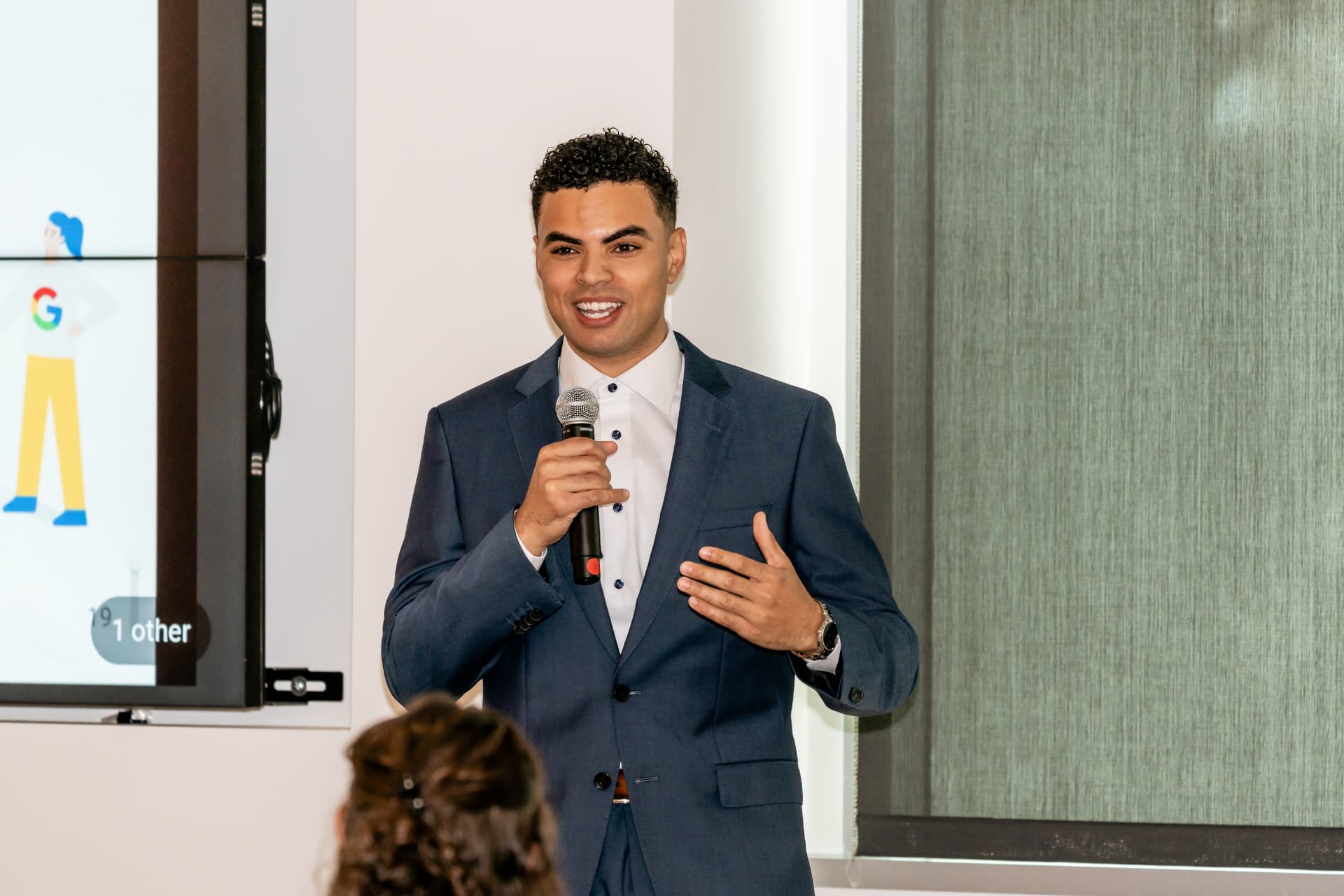 Kenton D. Raiford speaking with a microphone at a Google event